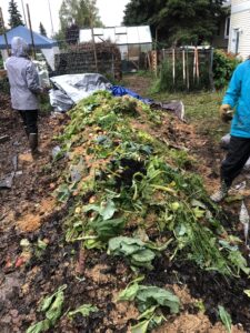 Two people unveiling the I St. garden beds